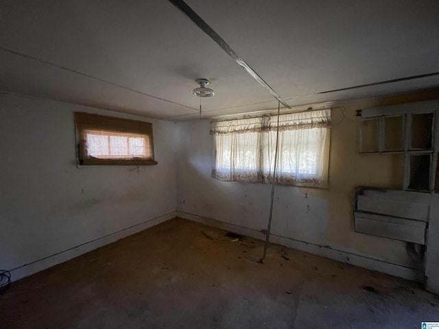 spare room featuring baseboards