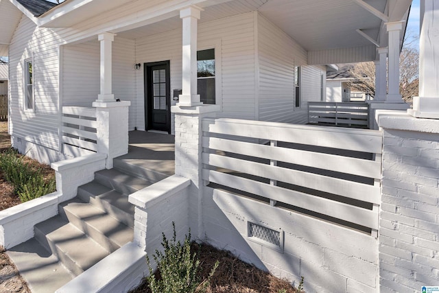 entrance to property featuring a porch