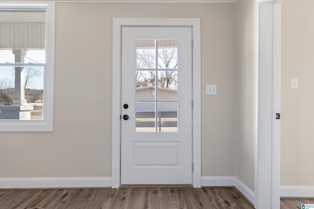 doorway to outside with hardwood / wood-style floors