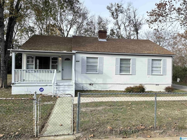 view of front of home featuring covered porch and a front yard