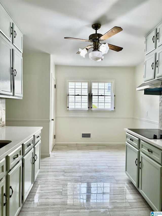 kitchen with ceiling fan and black electric stovetop