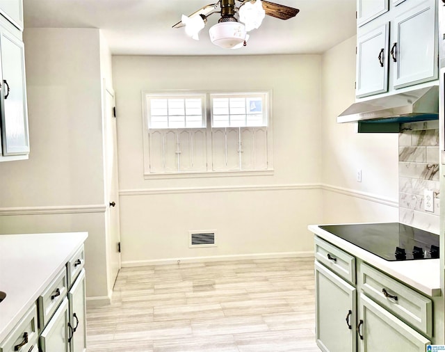 kitchen with black electric cooktop and light hardwood / wood-style flooring