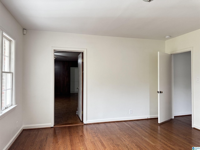 spare room featuring dark hardwood / wood-style flooring