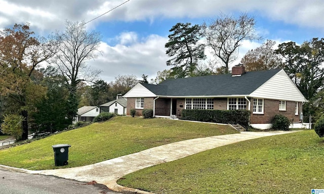 ranch-style house with a front yard