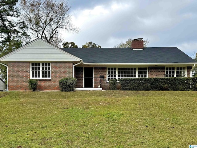 ranch-style home featuring a front yard