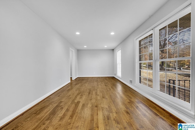 empty room featuring wood-type flooring