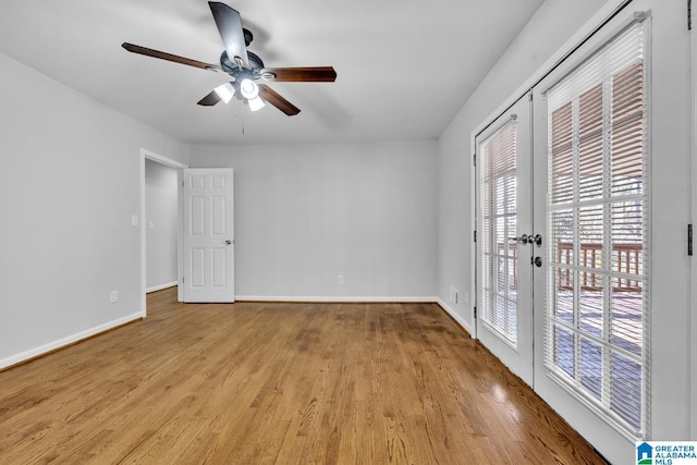 spare room featuring ceiling fan, light hardwood / wood-style flooring, and french doors