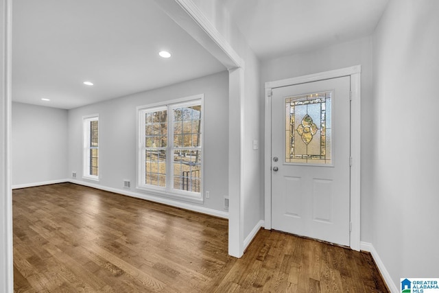 entryway with hardwood / wood-style floors