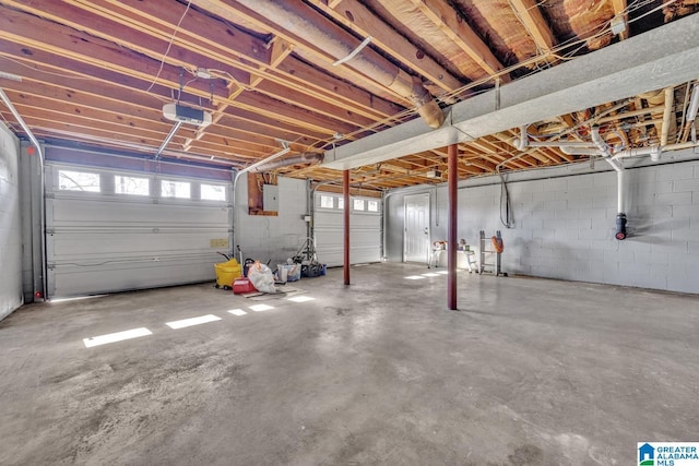 garage with electric panel and a garage door opener