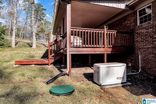 view of side of property with a lawn and a wooden deck