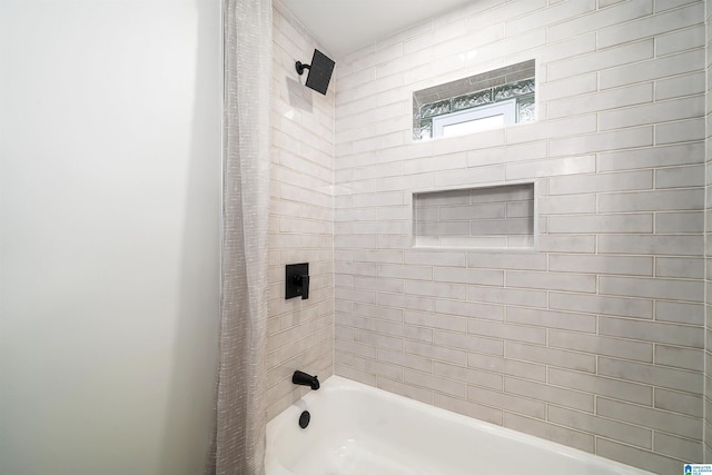 bathroom with shower / bath combination with curtain