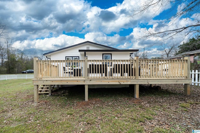 back of property with a wooden deck