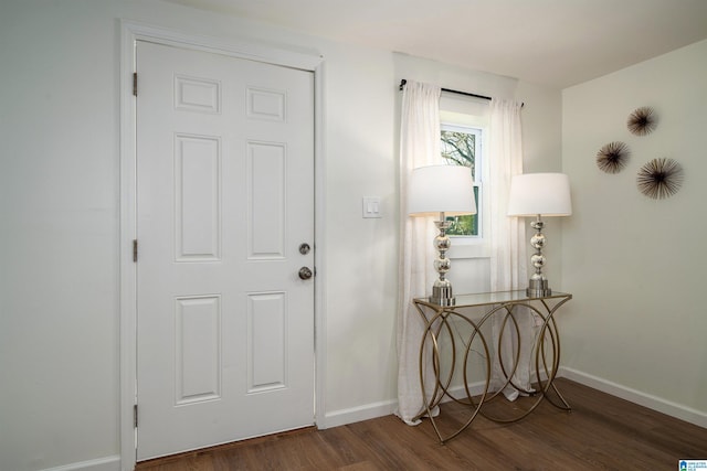 foyer with dark hardwood / wood-style flooring