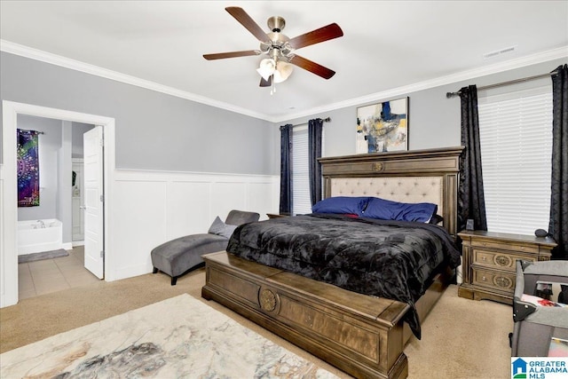 bedroom with ensuite bathroom, ceiling fan, and crown molding