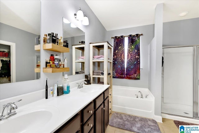 bathroom with tile patterned floors, vanity, and separate shower and tub