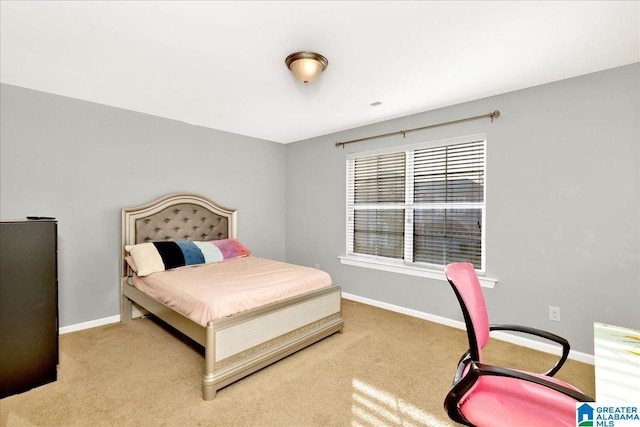 bedroom featuring light carpet