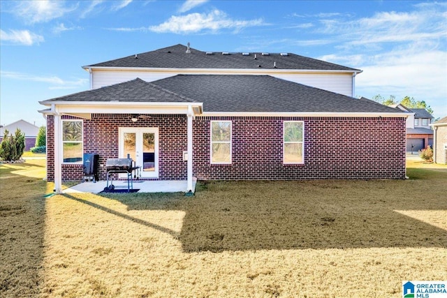 back of house featuring a yard and a patio