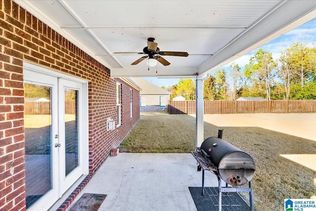 view of patio / terrace featuring ceiling fan and french doors