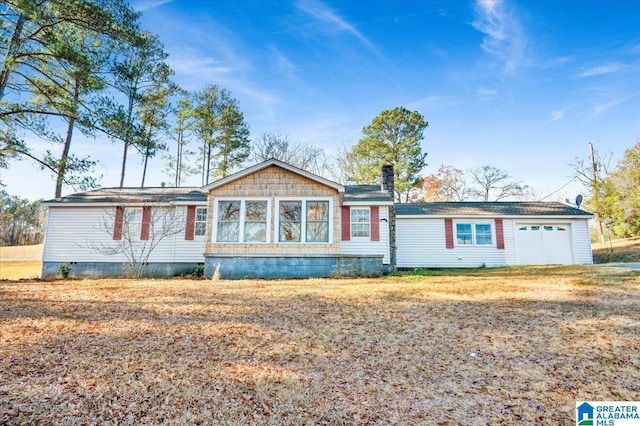 single story home featuring a garage