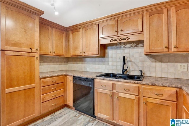 kitchen featuring light stone countertops, sink, black dishwasher, decorative backsplash, and light wood-type flooring