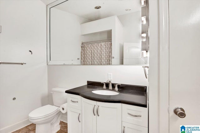 bathroom featuring a shower with shower curtain, tile patterned floors, vanity, and toilet