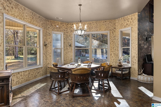 dining space featuring a notable chandelier