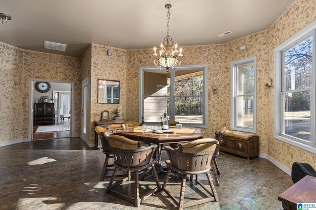 dining space with a notable chandelier