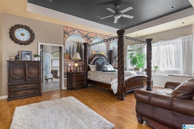 bedroom with hardwood / wood-style flooring and ceiling fan