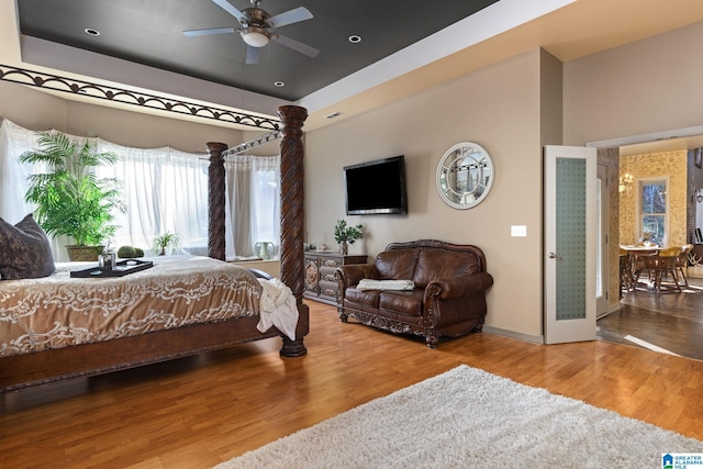 bedroom featuring wood-type flooring and ceiling fan