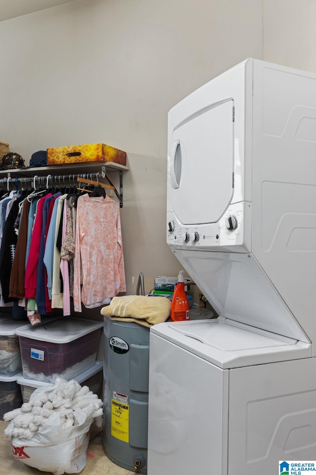 washroom featuring stacked washer / dryer