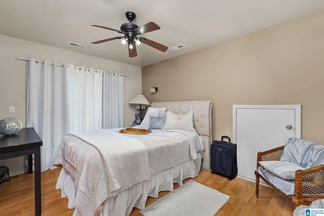 bedroom featuring light hardwood / wood-style flooring and ceiling fan