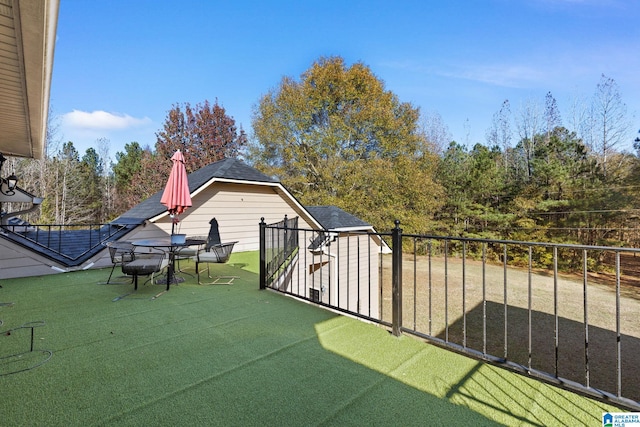 view of patio featuring a storage shed