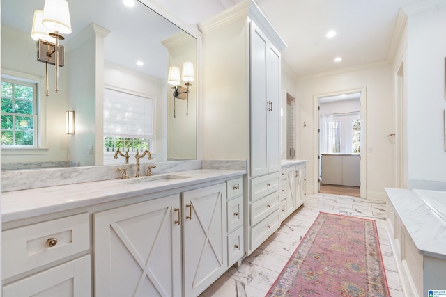 bathroom with vanity and ornamental molding