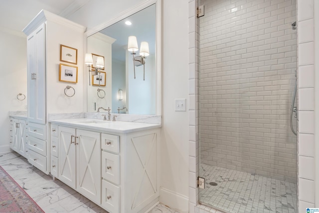 bathroom with vanity, a shower with door, and crown molding