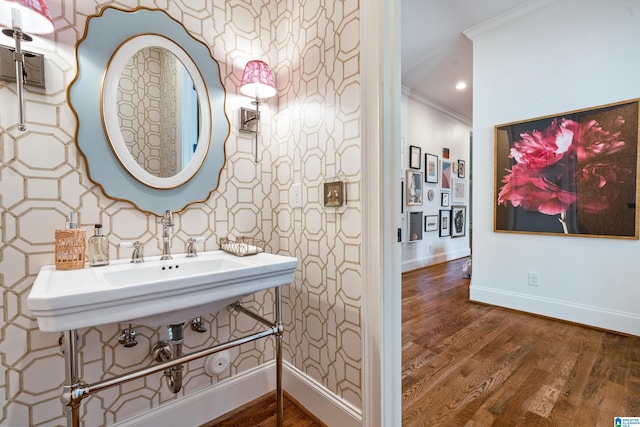 bathroom with hardwood / wood-style floors and ornamental molding