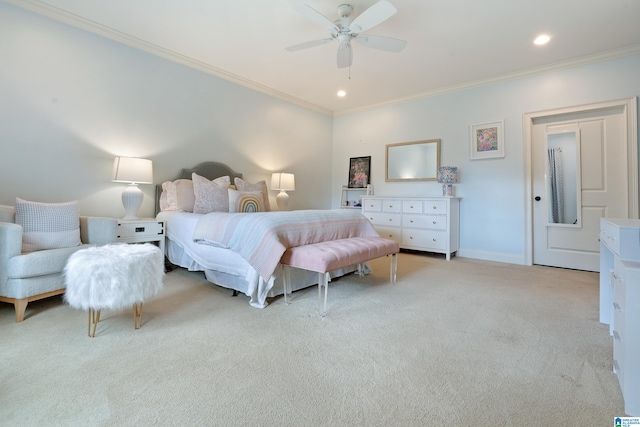 carpeted bedroom featuring ceiling fan and crown molding