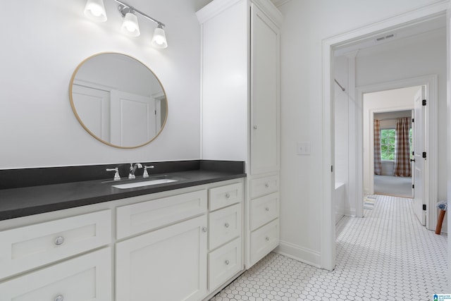 bathroom featuring tile patterned flooring and vanity