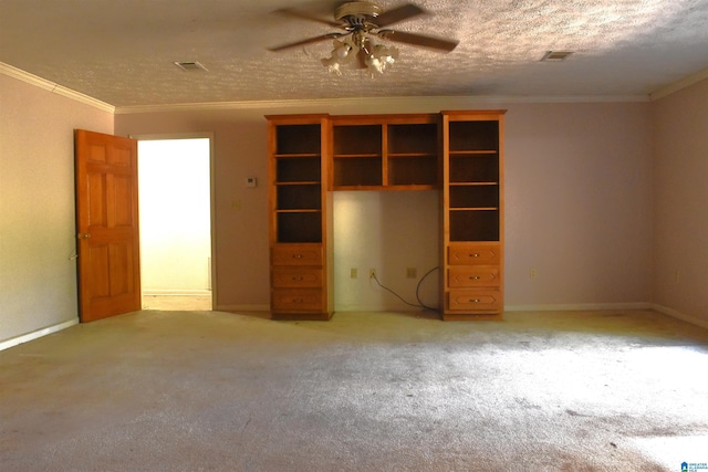 unfurnished bedroom with visible vents, crown molding, baseboards, and carpet floors