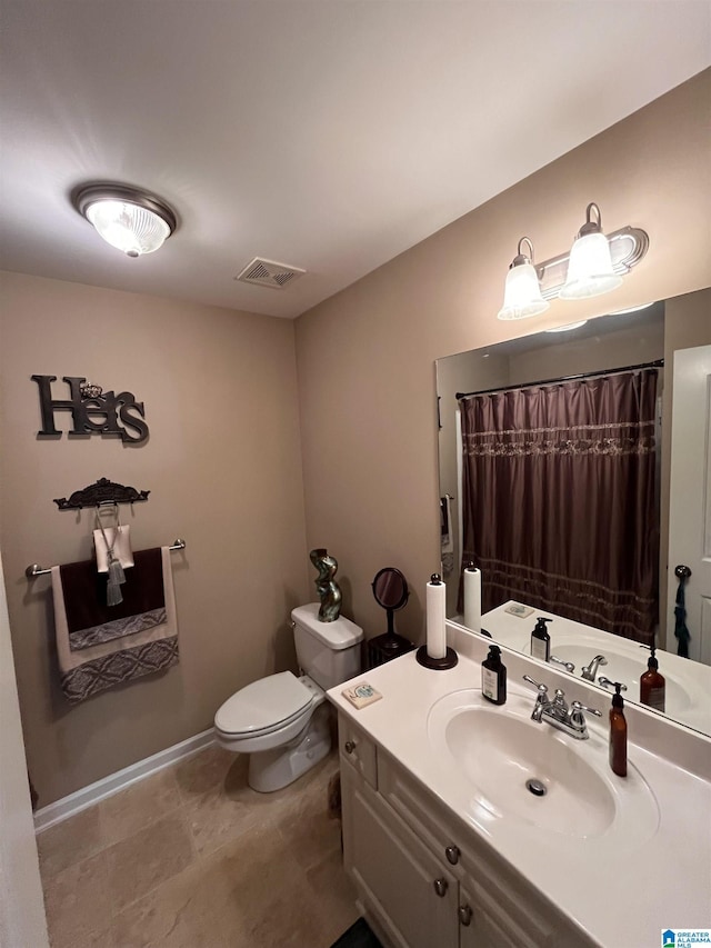 bathroom featuring vanity, a shower with shower curtain, and toilet