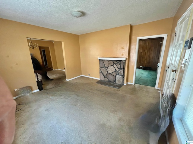 carpeted living room featuring a textured ceiling