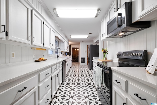 kitchen with white cabinets, appliances with stainless steel finishes, and sink