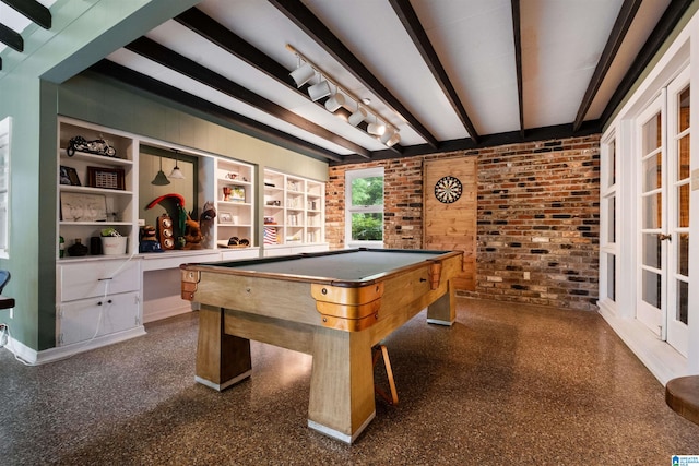 recreation room with beam ceiling, billiards, and brick wall