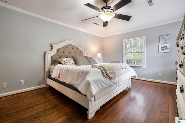 bedroom featuring ceiling fan, dark hardwood / wood-style flooring, and crown molding