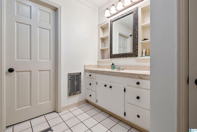 bathroom with vanity, tile patterned floors, and crown molding