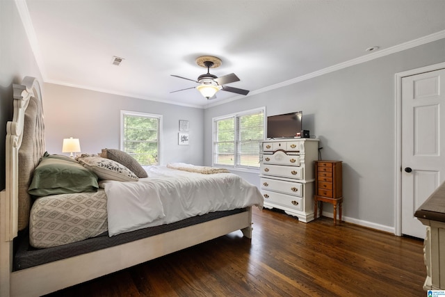 bedroom featuring ceiling fan, dark hardwood / wood-style floors, and crown molding