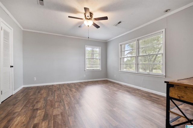 spare room with ceiling fan, dark hardwood / wood-style flooring, and ornamental molding