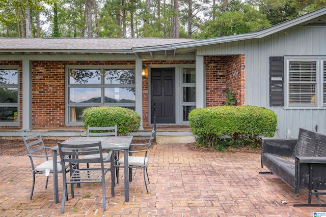 property entrance featuring a patio