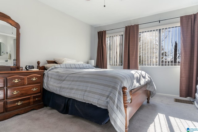 bedroom featuring light colored carpet