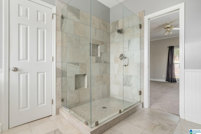 bathroom featuring tile patterned flooring, walk in shower, ornamental molding, and ceiling fan