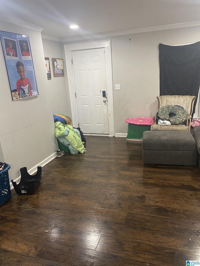 living area featuring dark wood-type flooring and crown molding